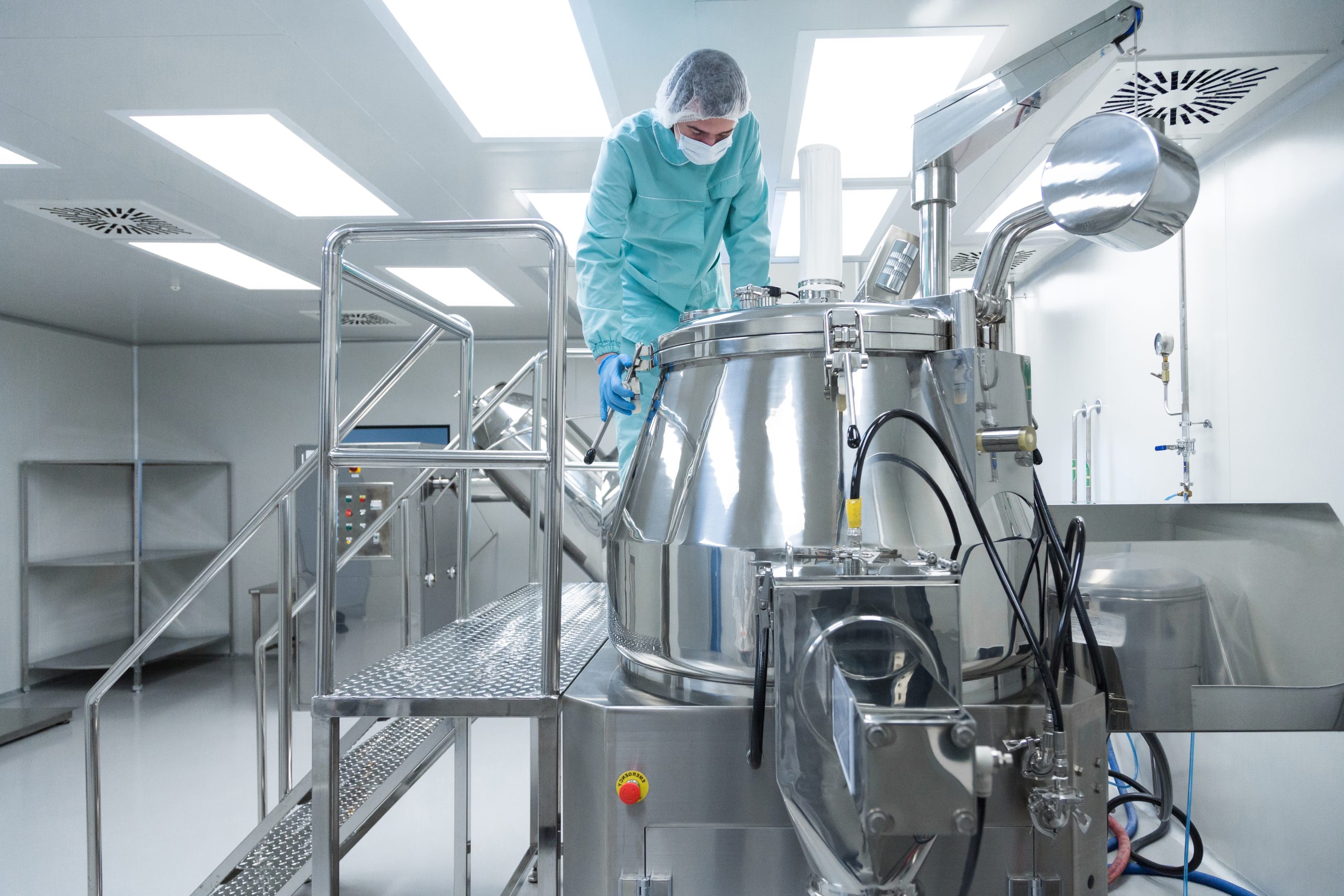 Pharmaceutical technician in sterile environment at pharmacy industry