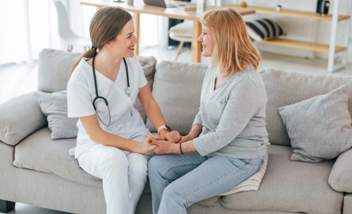 Senior woman have consultation by young female doctor indoors.